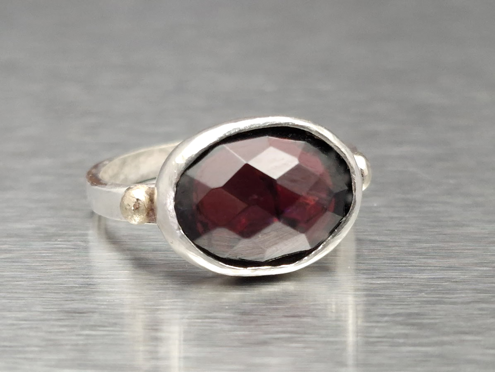 Handmade Sterling Silver Garnet Ring: Oval Red Gemstone, Gold Accent