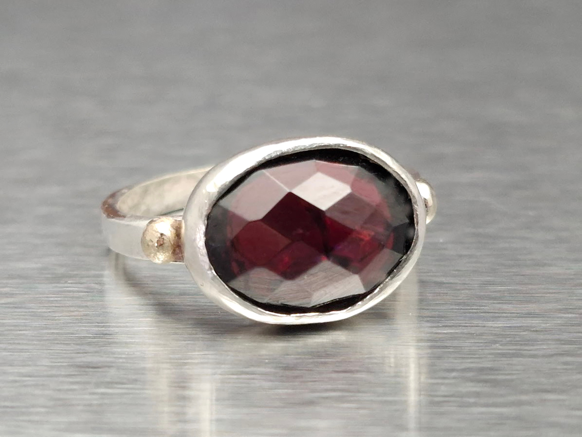 Handmade Sterling Silver Garnet Ring: Oval Red Gemstone, Gold Accent מכסף עבודת יד אמן ישראלי