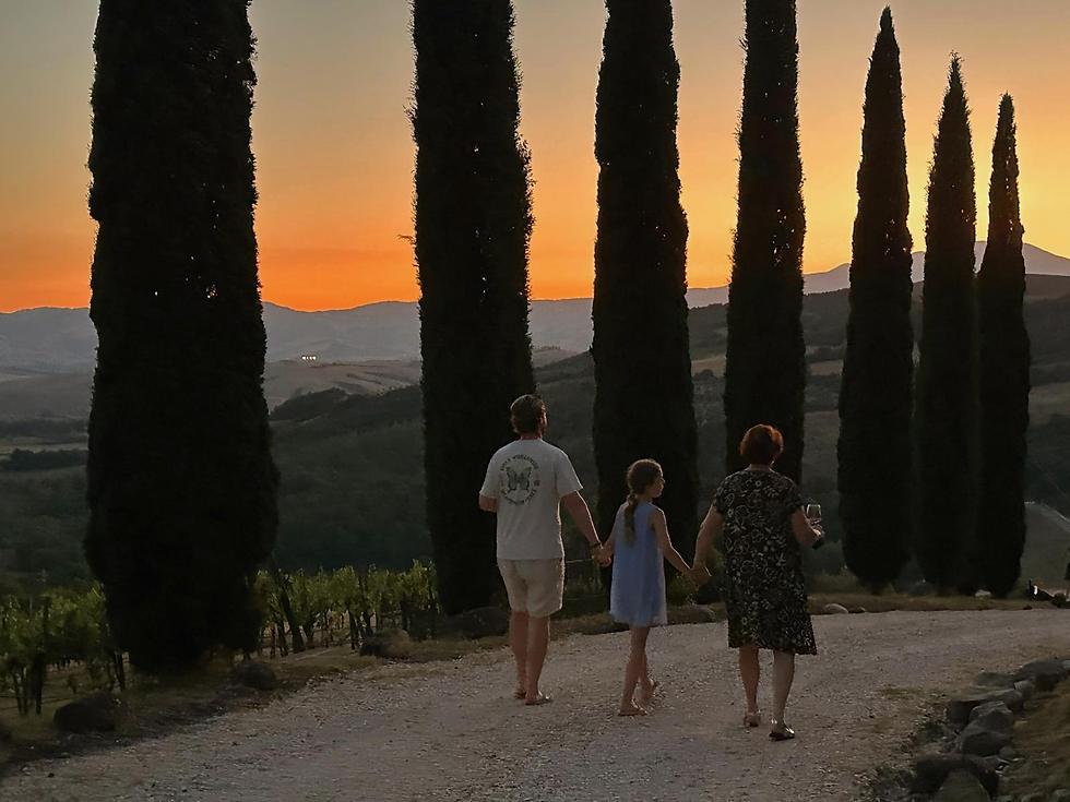 walking woodland paths, olive groves, and vineyards surrounding a castle.
