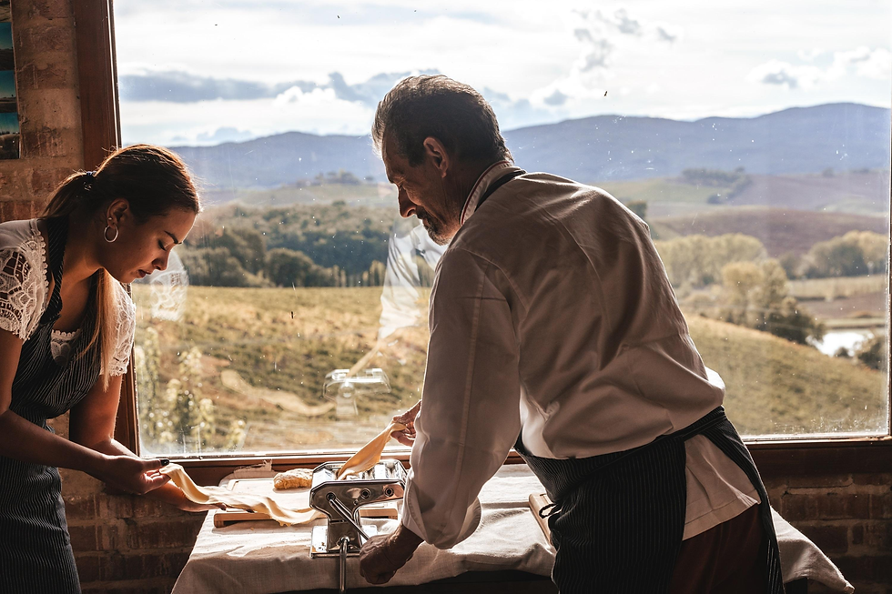 A rustic winery kitchen where fresh pasta is being prepared before adding shaved truffles.
