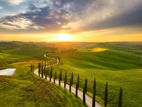 Val d'Orcia is universally praised by travelers as a postcard-perfect Tuscan landscape, celebrated for its rolling golden hills, cypress-lined driveways, and medieval villages.