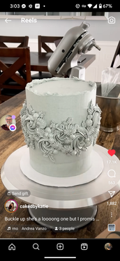 Elegant sage green cake with floral details