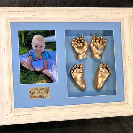 Baby blue mat board bright gold casts in bone frame