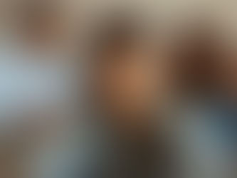 Adolescent sitting in the foreground while parents argue in the background, representing grief, divorce, and emotional impact of family separation