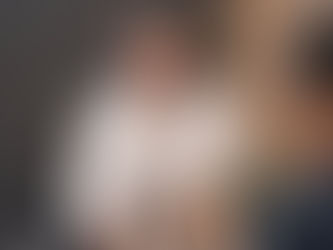 Person sitting in a therapy session with therapist, having a relaxed and open conversation, representing connection and trust in therapy