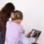 Family reviewing dental X-rays at a dental clinic in Lincoln.