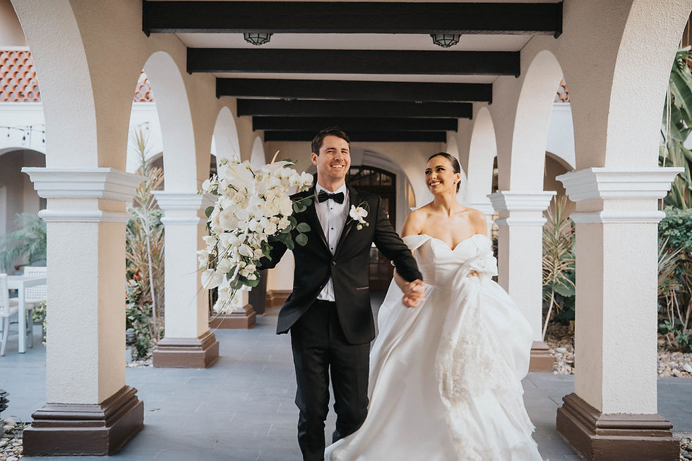 bride and groom having fun while running