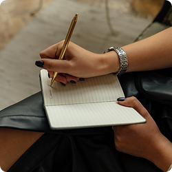 Executive writing strategic business plans during a commercial planning session.