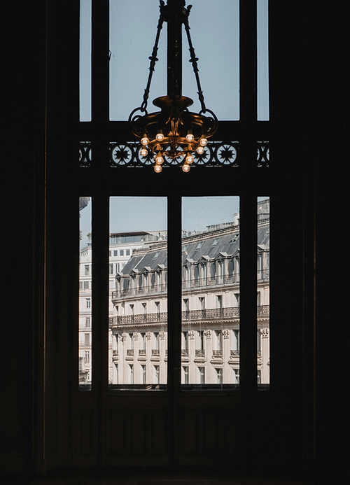 Elegant Parisian architecture representing the heritage and structure of luxury fashion brands.