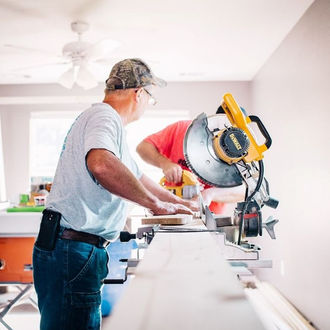 Man using a circular saw on a home modification on the Mid North Coast