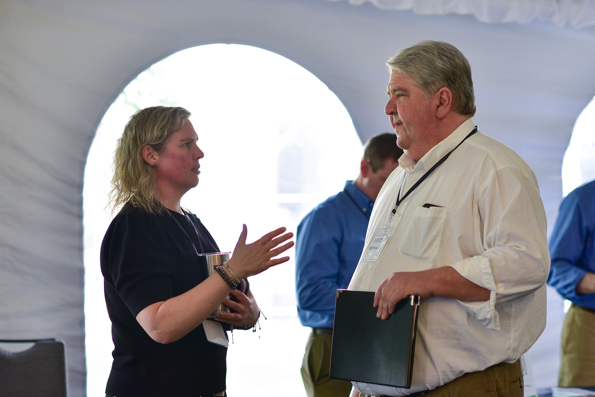 woman and man standing speaking