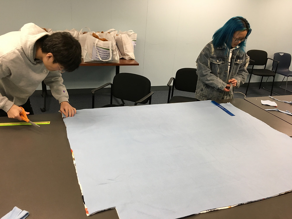 Students Haocheng Pan and Rain Tang carefully measure their cuts to create a superior product