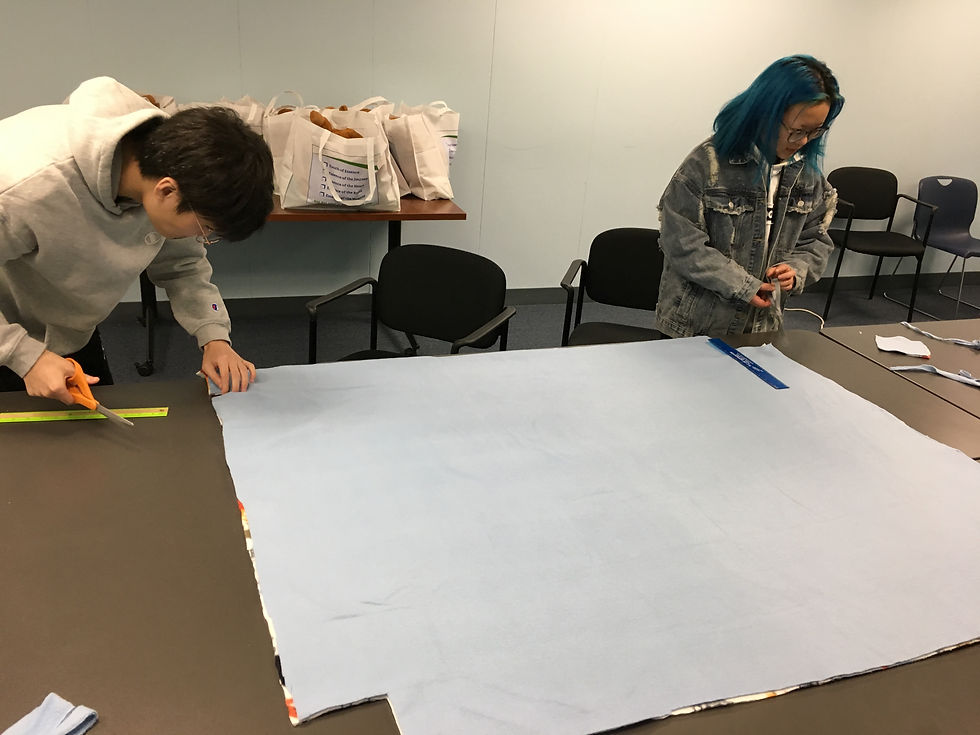 Students Haocheng Pan and Rain Tang carefully measure their cuts to create a superior product