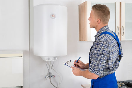 Plumber checks hot water system.