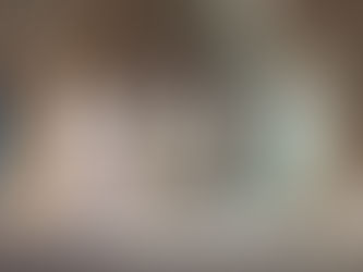 Transparent light beams filtered through stained glass filling a quiet medieval cathedral with calm, open atmosphere.