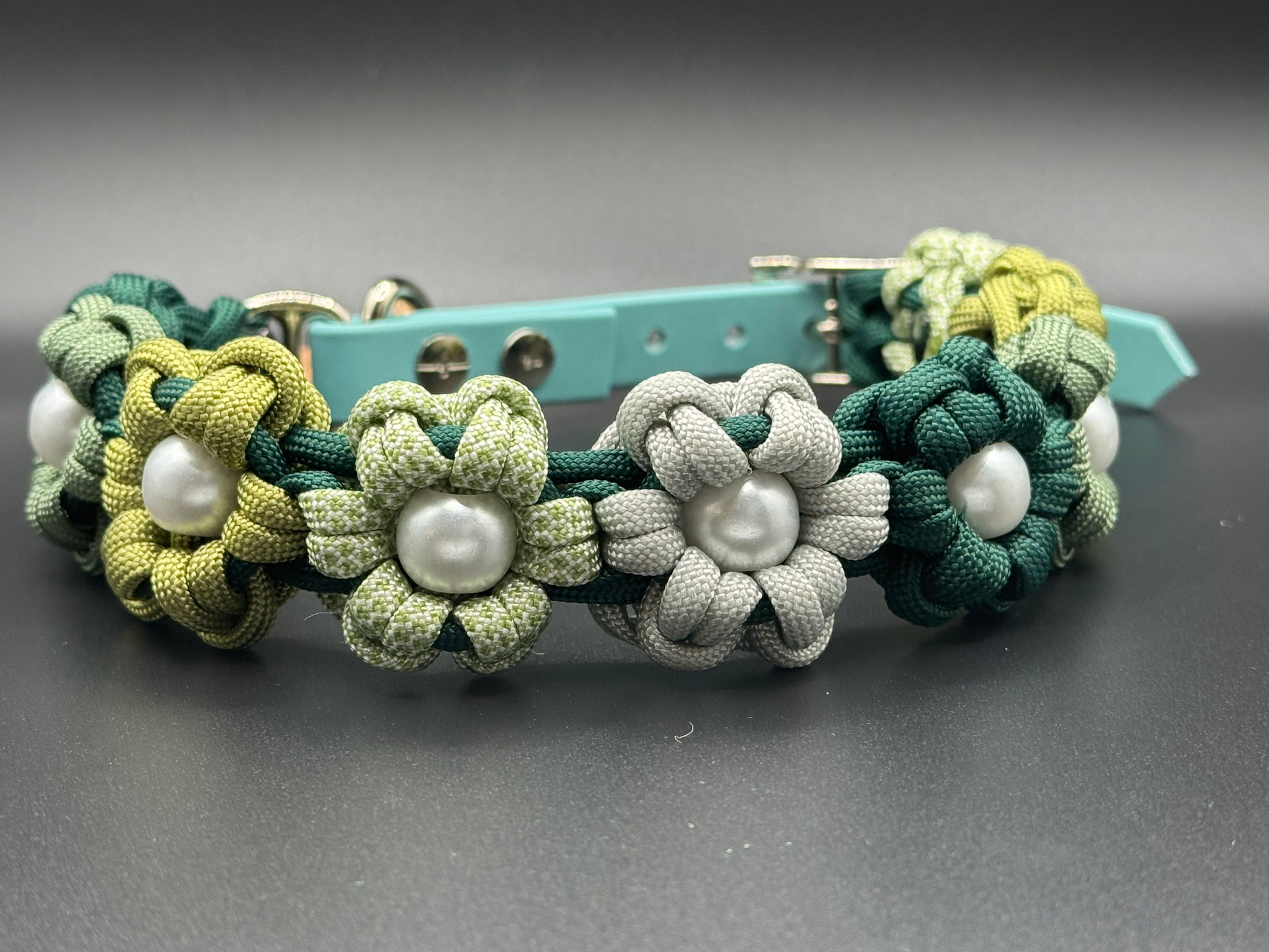 Hand woven paracord dog collar in Aztec Sun Bar pattern in shades of cool summer greens