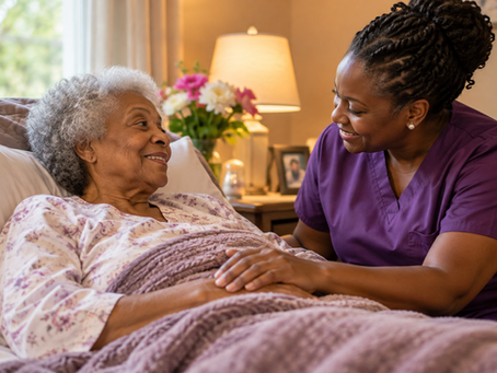 Senior woman receiving compassionate hospice support from a caregiver in a warm assisted living setting.