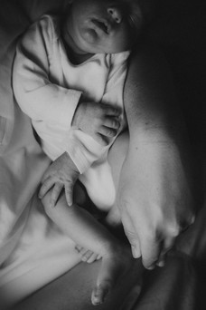 A black and white photo of a newborn