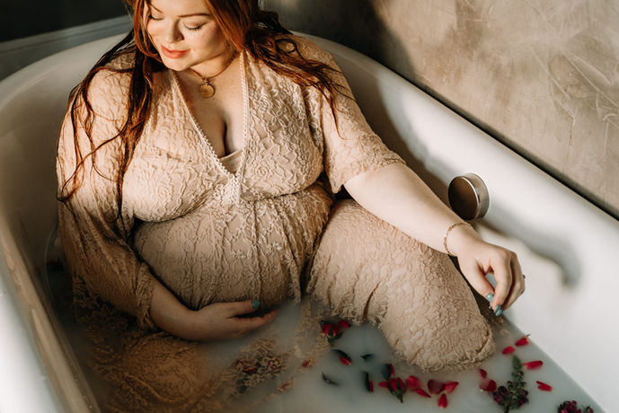Harrisburg PA maternity photographer photographs a pregnant woman in a Milk bath