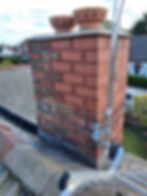 Brick chimney repair work by roofers in Wirral