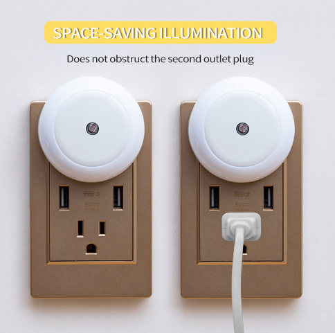 Two round white LED night lights shown next to a standard wall socket, demonstrating the compact plug-in design.