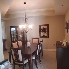 Freshly painted neutral-colored residential kitchen and dining area in Venice, Florida by Best Paint Lines.