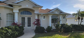 Freshly painted modern residential home exterior featuring contemporary architecture in Venice, Florida by Best Paint Lines.