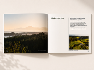 Open spread of the Tasman Property Journal featuring a market overview, regional property insights and a landscape photograph of Mahana Ridge in Upper Moutere.