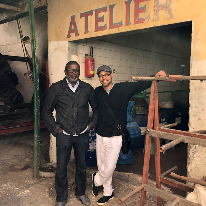 Bibi Seck and Dr. Monte Oyd Harris smiling together in a workshop.
