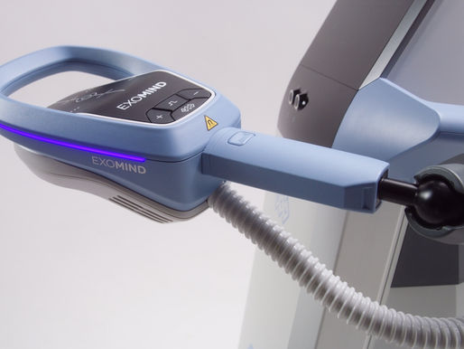 Futuristic light-blue EXOMIND medical device.