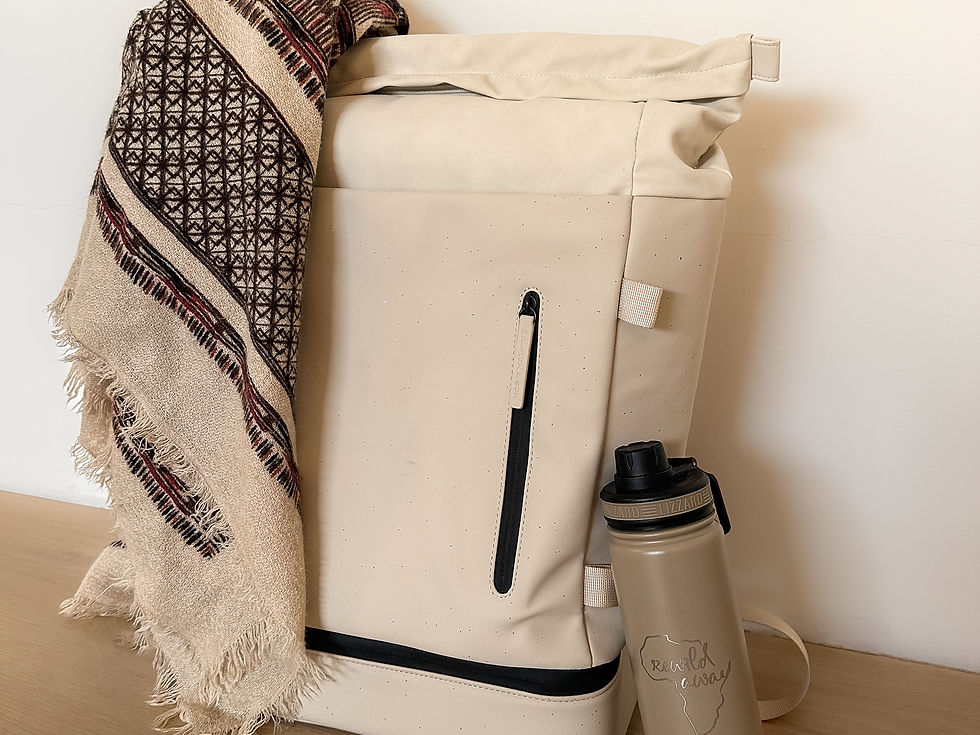 A bag, scarf and water bottle branded with ReWild Away