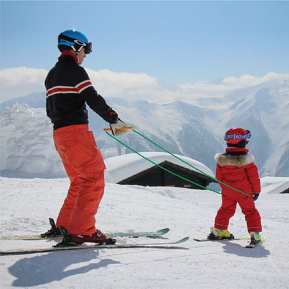 Child skiing with parent using Slope Ropes (tm)