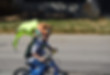 toddler riding bike with safety visibility wings