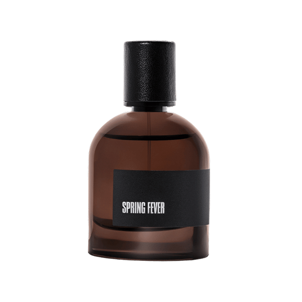 Spring Fever niche citrus perfume bottle on a black background