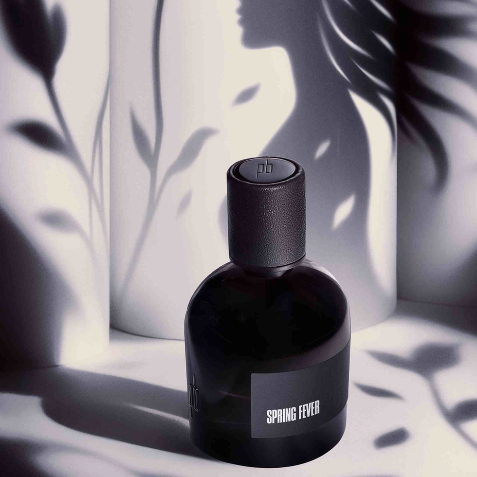 Spring Fever niche citrus perfume bottle among shadows