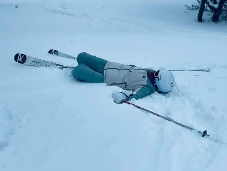 Skier fallen in snow. A metaphor for life lessons
