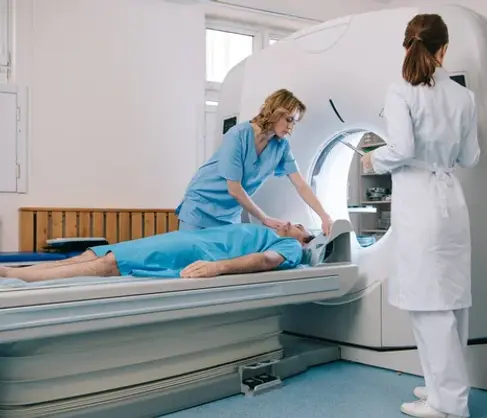 depositphotos_268361808-stock-photo-radiologist-white-coat-standing-scanner.jpg