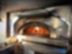 Wood-fired pizza over "Give Pizza Chance" Mayne Island
