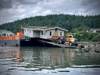 House being unloaded from the barge on Mayne Island