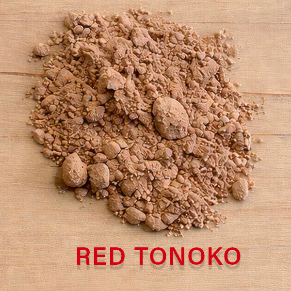 Close-up of Red Tonoko powder with high iron oxide content for Kintsugi intermediate layers.