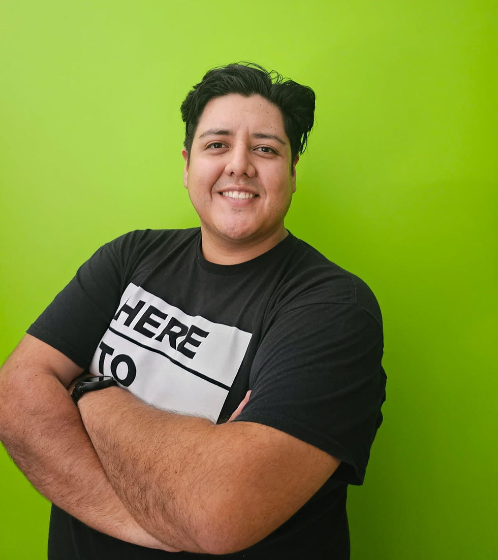 Smiling man with arms crossed in a black t-shirt