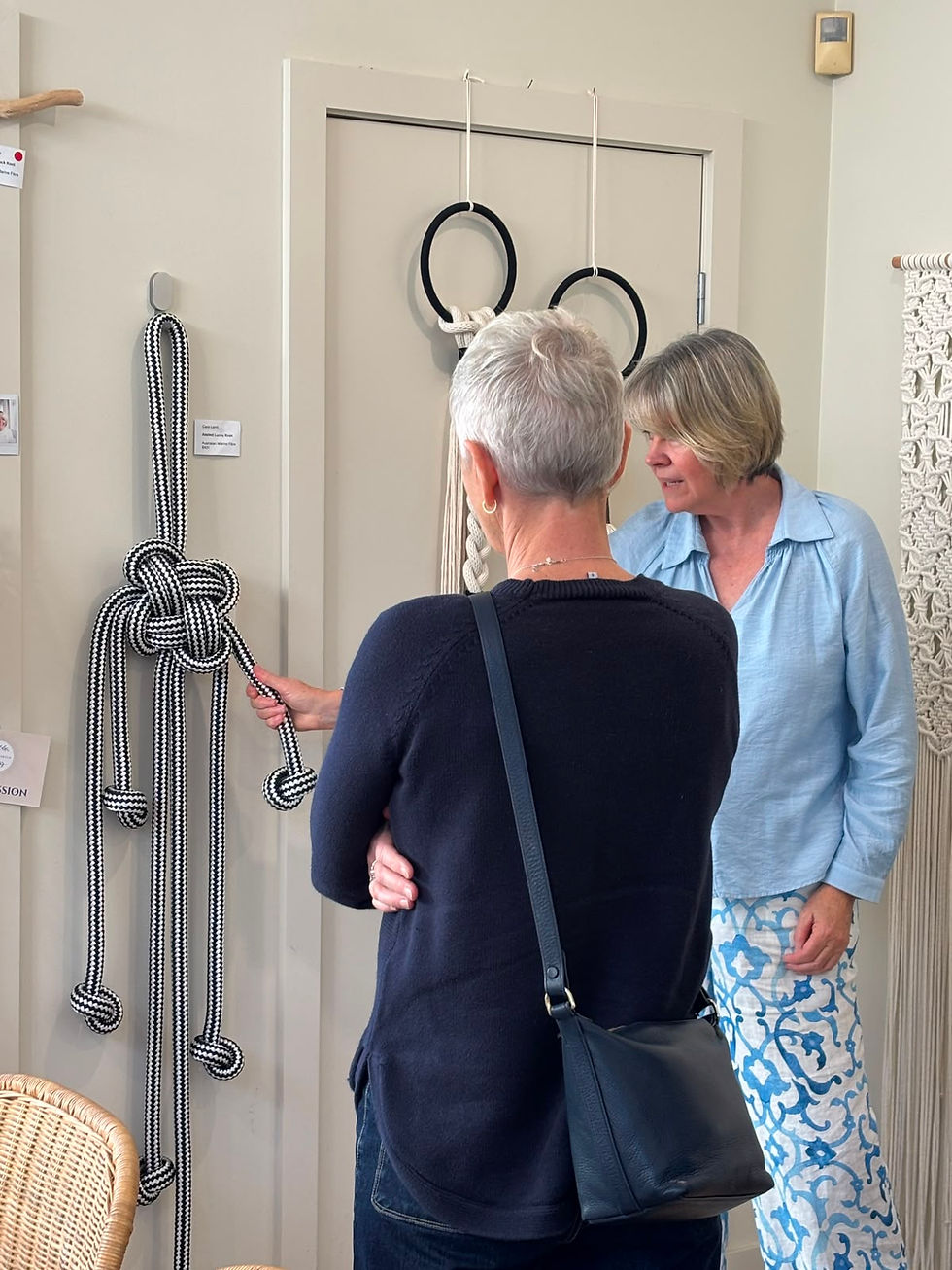 May & Myrtle artist Carol Taylor chatting with a visitor about fibre artworks in her studio during the Pittwater Artists Trail.