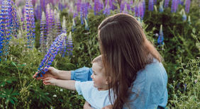 Mother and son with purple flowers