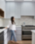 Lara in blue kitchen