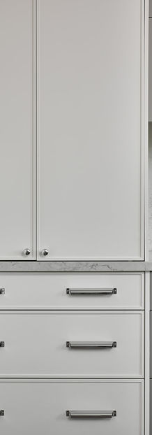 White kitchen cupboards with silver hardware