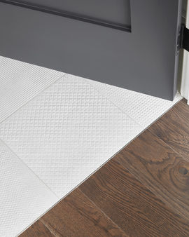 White tile and hardwood transition