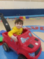 Boy in push car