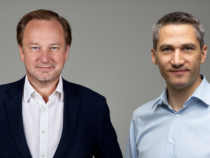 Two men standing together from Heineken, appointing a Chief Digital & Technology Officer.