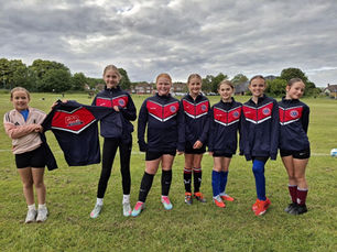 A group of young girls coming together for youth sports, sponsored by GAP Hire Solutions.