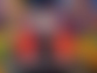 Children sitting on a stationary giant train. 